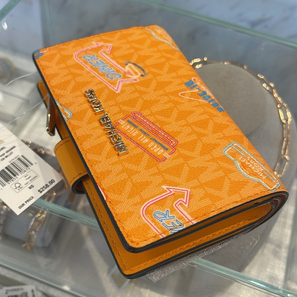 Michael Kors Jet Set Travel Md Printed Signature Logo Bi-Fold Wallet
Pop Orange - Picture 6 of 16